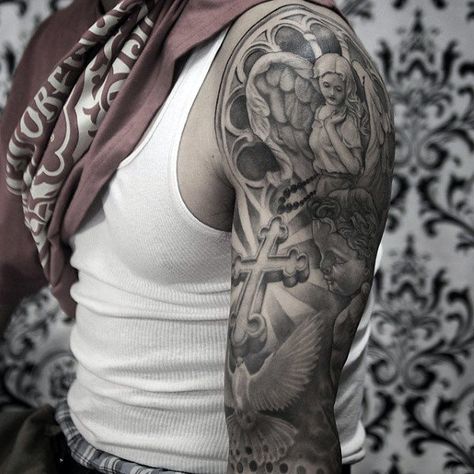 Sleeve Guys Shaded Black And Grey Catholic Themed Tattoo Ideas Catholic Sleeve Tattoo Men, Catholic Sleeve Tattoo, Dres Drawings, Catholic Tattoos Sleeve, Half Sleeve Tattoos Color, Upper Half Sleeve Tattoos, Angel Sleeve Tattoo, Guardian Angel Tattoo Designs, Catholic Tattoos