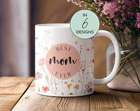 "Celebrate mom with our Best MOM Ever Appreciation Gift, the perfect Mother's Day Cup adorned with a charming wild floral garden design. This pastel mug is sure to inspire joy and gratitude in the heart of your beloved mother. 𝗜 𝗧 𝗘 𝗠__𝗗 𝗘 𝗧 𝗔 𝗜 𝗟 𝗦 ☕️Ceramic Mug * 11 oz (325 ml) mug dimensions: 3.79″ (9.6 cm) in height, 3.25″ (8.3 cm) in diameter * 15 oz (444 ml) mug dimensions: 4.69″ (11.9 cm) in height, 3.35″ (8.5 cm) in diameter * 20 oz (591 ml) mug dimensions: 4.3″ (10.9 cm) in height, 3.7″ (9.3 cm) in diameter * Dishwasher and microwave safe 𝗛 𝗢 𝗪__𝗧 𝗢__𝗢 𝗥 𝗗 𝗘 𝗥 1. Select Mug Size from menu. 2. Select Design from menu and design of your choice will be displayed. 3. Select the quantity that you want. 4. Click \"ADD TO BASKET\"  5. Provide your phone number for a Flower Pastel, Best Wife Ever, Best Auntie Ever, Gift Idea For Mom, Celebrate Mom, Photo Proof, Best Mom Ever, Garden Inspired, Mom Mug