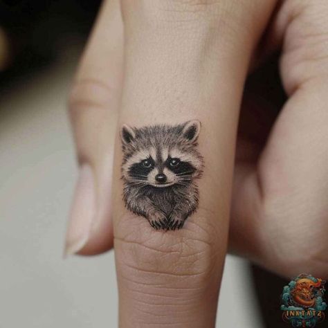 Unmasking the Meaning: Exploring the Fascinating World of Raccoon Tattoos: 128 Designs - inktat2.com Small Raccoon Tattoo, Raccoon Tattoos, Tattoo Sisters, Racoon Tattoo, Bandana Tattoo, Blackberry Tattoo, Small Animal Tattoos, Ems Tattoos, Raccoon Tattoo