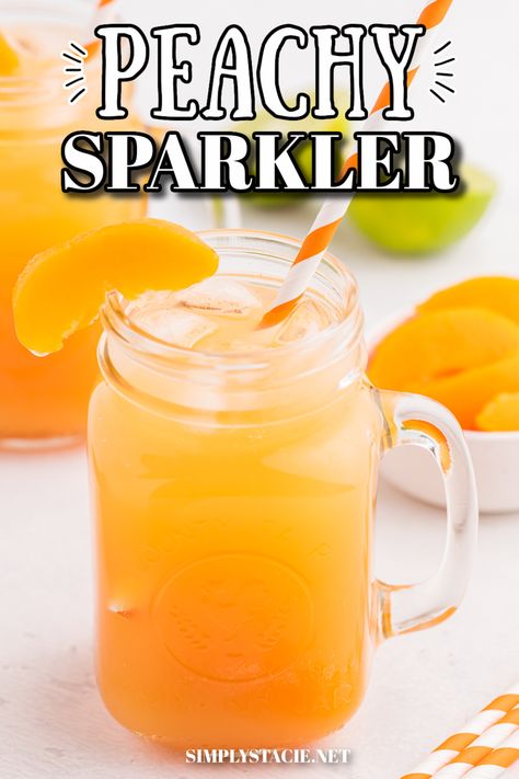 A glass of Peachy Sparkler drink with a striped orange straw and garnished with a peach slice. Peach Slushies Non Alcoholic, Peach Beverages, Peach Drink Recipes Nonalcoholic, Peach Punch Recipes Non Alcoholic, Peach Punch Alcoholic, Peach Punch Non Alcoholic, Peach Punch Recipes, Peach Drinks Non Alcoholic, Peach Mocktail Non Alcoholic