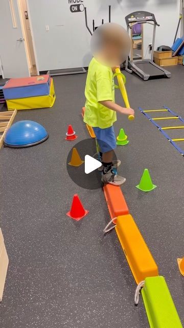 More Than A Gym on Instagram: "Multistep motor planning and balance challenge! Tasked to place a colored ring on a cone by transferring it on a bat after first tapping the cone with their foot.  #morethanagym #pedipt #pediatricpt #pediatricphysicaltherapy #physicaltherapy #balancebeam #balance #kidsactivities #motorplanning #grossmotor #grossmotordevelopment" Motor Planning Activities, Balance Challenge, Pediatric Physical Therapy Activities, Pediatric Pt, Physical Therapist Assistant, Pediatric Physical Therapy, Occupational Therapy Activities, Motor Planning, Physical Activities For Kids