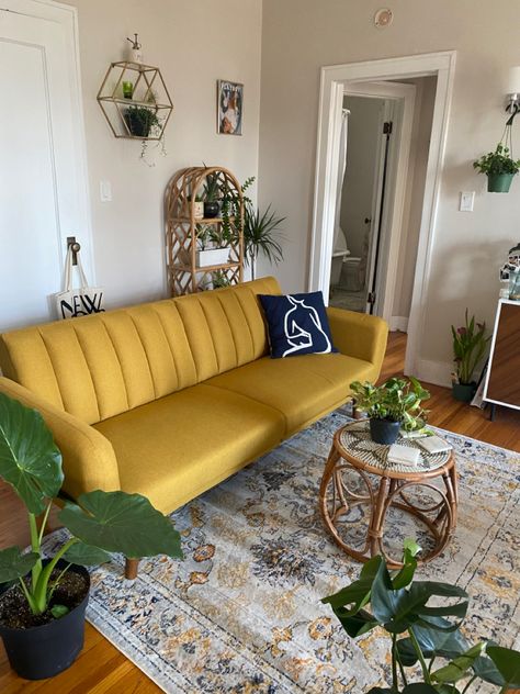 Mustard Futon Living Room, Yellow Living Room Couch, Yellow Vintage Couch Living Room, Rug With Yellow Couch, Yellow Aesthetic Living Room Decor, Yellow Couch Boho Living Room, Mid Century Modern Living Room Yellow Couch, Yellow Velvet Sofa Living Room Ideas, Yellow Apartment Decor Living Room