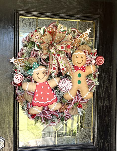 This Mr. & Mrs. Gingerbread wreath is to adorable for words.  The boy and girl gingerbread signs are metal and surrounded by lots of gingerbread and candy themed picks, beautiful mesh and flocked greenery.  A big beautiful bow completes the wreath.  This is made on a pine evergreen wreath base and is a little heavier than most wreaths so a solid over the door hanger is recommended.  This would be a perfect wreath to carry you through the winter and to brighten your door this Christmas Please not Gingerbread Mesh Wreath, Gingerbread Wreaths Christmas, Gingerbread Signs, Gingerbread Wreaths, Gingerbread Man Wreath, Girl Gingerbread, Gingerbread Couple, Gingerbread Kitchen, Gingerbread Wreath