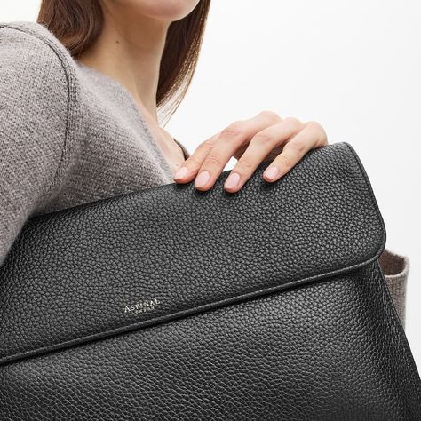 Our Leather Laptop Case is the stylish answer to carrying your laptop on the go. Handcrafted from full-grain leather, a flap closure opens to reveal a single compartment lined in butter soft grosgrain which accommodates your laptop. A magnetic-dot closure and corner stitching complete the design. Create a truly unique gift for yourself or a loved one by personalising our Leather Laptop Case with our luxury personalisation service. Corner Stitching, Artist Portfolio Book, Leather Laptop Case, Aspinal Of London, Black Pebbles, Leather Laptop, Leather Sleeve, Laptop Case, Full Grain Leather