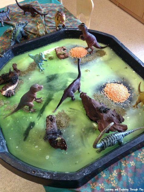 Dinosaur Sensory Swamp Tuff Tray Tuff Tray Dinosaurs, Swamp Sensory Bin, Animal Tuff Tray Ideas Eyfs, Tuff Tray Ideas For Under 2s, Animal Tuff Tray, Animal Tuff Tray Ideas, Baby Tuff Tray Ideas, Nursery Tuff Tray Ideas, Tuff Tray Ideas For Babies