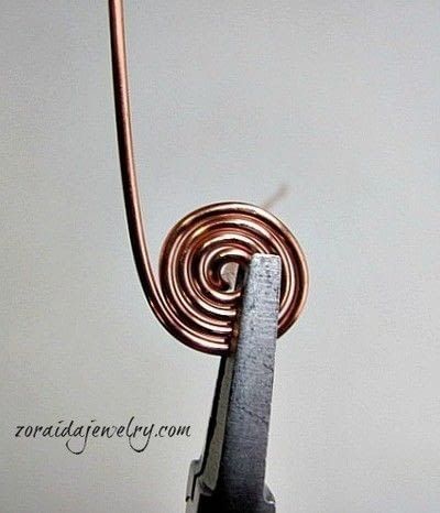 How to make a wire swirl ring. How To Make A Spiral Wire Ring - Step 4 Wire Jewelry Rings, Wire Wrap Jewelry Designs, Antique Stain, Bijoux Fil Aluminium, Ring Wire, Spiral Ring, Wire Jewelry Designs, Swirl Ring, Wire Ring