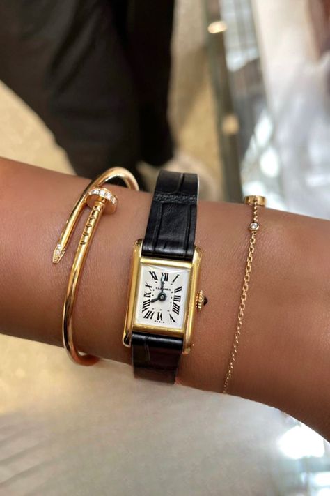 A photo of a hand wearing a cartier watch and bracelet Cartier Tank Stack, Love Ring Cartier, Cartier Tank Watch, Nail Gold, Juste Un Clou Bracelet, Thirty Flirty And Thriving, Jewelry Stack, 2023 Mood, Cartier Love Ring