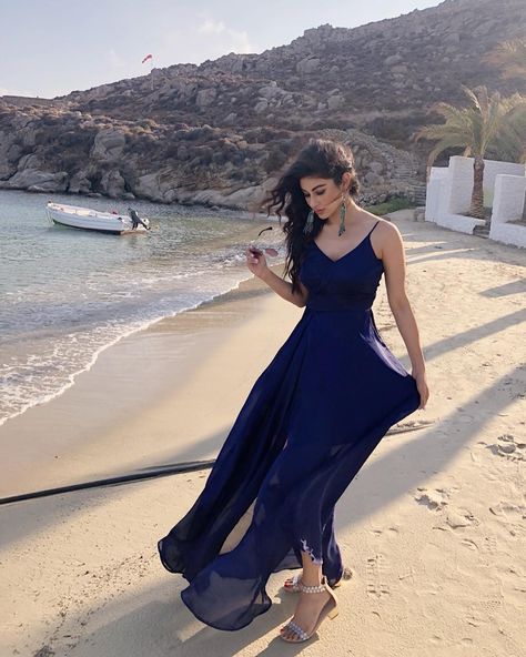 Mouni Roy, every fashion connoisseur's delight, is now taking over Greece with stylish shades of blue. And this time, it's a gorgeous maxi dress that's weaving the magic! Mouni Roy Dresses, Moni Roy, Mouni Roy, Gorgeous Maxi Dresses, Serial Actress, Indian Bridal Outfits, Blue Door, Indian Designer Outfits, Designer Dresses Indian