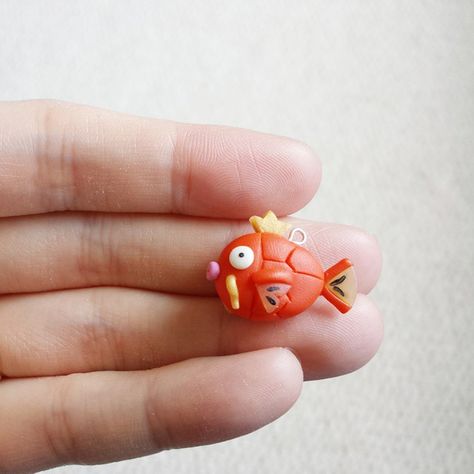 Magikarp did splash. And nothing happened. #vscocam #polymerclaycharm #polymerclay #polymer #clay #craft #diy #handmade #miniature #sculpey #fimo #fimolovers #premo #kawaii #cute #pokemon #magikarp Clay Pokemon, Polymer Clay Kawaii, Polymer Clay Sculptures, Clay Figures, Fimo Clay, Clay Miniatures, Cute Clay, Clay Dolls, Polymer Clay Charms