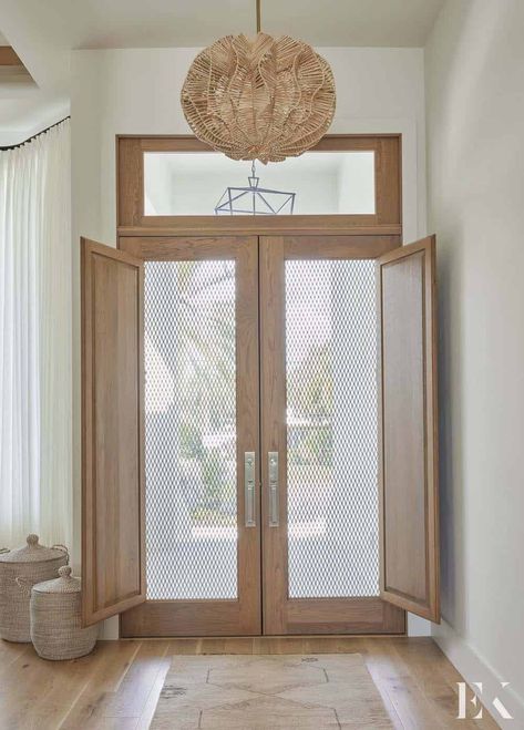 A Florida house gets beautifully renovated into a coastal contemporary retreat Coastal Foyer, Beach House Front Door, St Armands Circle, Wood Front Entry Doors, Interior Door Knobs, Coastal House, California Modern, Southern Living Homes, Coastal Contemporary