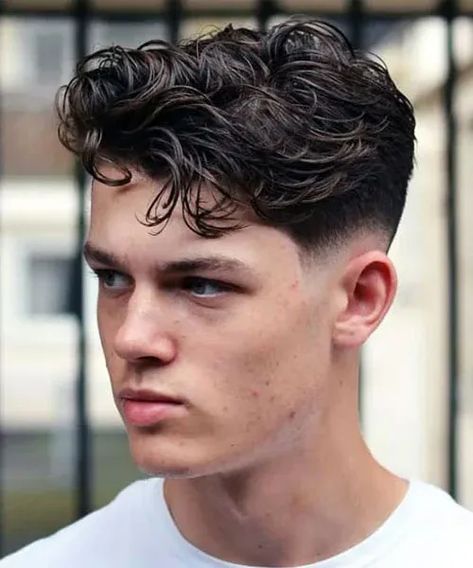 Messy Wavy Hair with Low Bald Fade - Cool Bald Fade Haircuts For Men, Skin Faded Styles #menshaircuts #menshairstyles #fade Curly Hairstyles 2023, Guys Hairstyles, French Haircut, Mens Modern Hairstyles, Men's Curly Hairstyles, Curly Hair Fade, Short Wavy Haircuts, Men Haircut Curly Hair, Wavy Hair Men