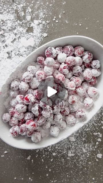 Jacqui Saldaña Simple Recipes on Instagram: "Candied Cranberries! These are tart, sweet and offer the perfect crunch. They’re a true delight and simple to make. Think of Candied Cranberries as a pre-Thanksgiving treat, maybe something to add to a charcuterie board, or add them to the dessert table 😋 #Thanksgiving #recipe   Candied Cranberries - Rinse and drain 1 bag of fresh cranberries. Place them in a bowl, add 1/4 cup of white sugar and 1/2 the juice of a lemon. Stir until the sugar is dissolved. Drain the cranberries and toss them on a baking sheet lined with parchment paper. Sprinkle 1 cup of powdered sugar on the cranberries and toss them until they are all coated. Bake the coated cranberries at 200 degrees for 15-20 minutes. Let them cool completely before enjoying! I like to store Candied Prosecco Cranberries, Candy Cranberry Recipe, Sugared Cranberries With Orange Juice, Cranberry Orange Juice Powdered Sugar, Candied Cranberries Recipe With Powdered Sugar, How To Make Candied Cranberries, Viral Powdered Sugar Cranberries, Cranberry Candy Powdered Sugar, Candy Cranberries Powdered Sugar