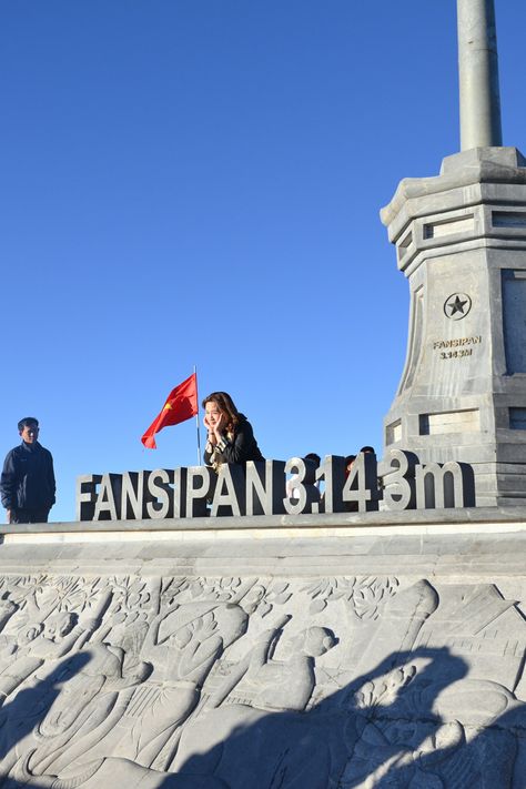 Image of a woman enjoying the view while sitting behind the sign at Fansipan Mountain in Vietnam Fansipan Vietnam, Fansipan Mountain, Sapa Vietnam, Vietnam Travel, Hanoi, Ferry Building San Francisco, Vietnam, Travel, Quick Saves