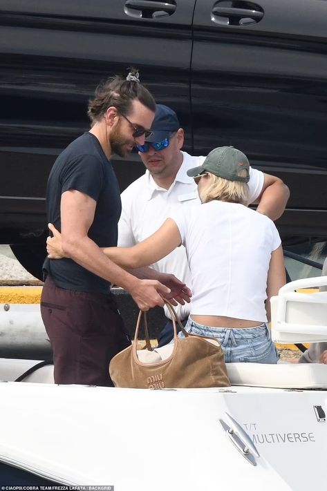 Gigi Hadid seen with boyfriend Bradley Cooper's daughter Lea, 7, for the FIRST time as they enjoy family vacation in Sardinia | Daily Mail Online Whirlwind Romance, Green Baseball Cap, Pulled Back Hairstyles, Hadid Sisters, With Boyfriend, Vogue Covers, Bradley Cooper, Short Blonde, Short Blonde Hair