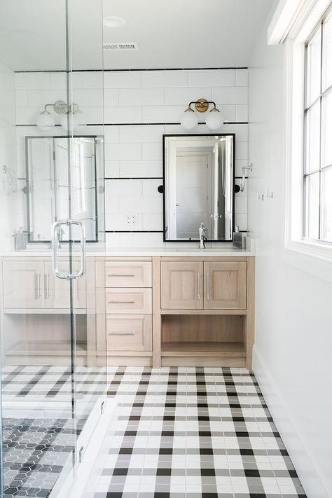 Black and white plaid bathroom floor tiles frame a seamless glass shower boasting black hex floor tiles and lead to oak his and hers washstands boasting polished nickel faucets mounted beneath oil rubbed bronze rectangular pivot mirrors. Plaid Tile, Patterned Bathroom Tiles, Style Me Pretty Living, Interiors Photography, Bad Inspiration, Boys Bathroom, Complete Bathrooms, Tile Floors, Bathroom Floor Tiles