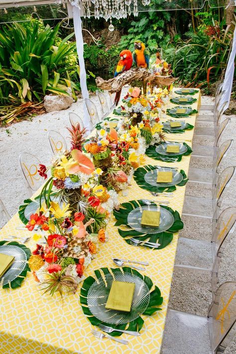 Yellow tablecloth for a tropical wedding table Tropical Wedding Table, Tropical Wedding Reception, Tropical Table, Backyard Dinner, Yellow Tablecloth, Lucite Chairs, Bold Centerpieces, Tropical Wedding Theme, Tropical Wedding Inspiration