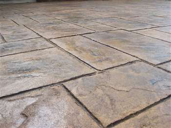 A close up of the Marigold, Roman Ashlar Slate, and Tan release powder patio. Solomon Colors Stamped Concrete, Tiny Pool House, Walkout Basement Patio, Basement Patio, Stamped Concrete Patio Designs, Bathroom Flooring Options, Tiny Pool, Pool House Shed, Concrete Stain Patio