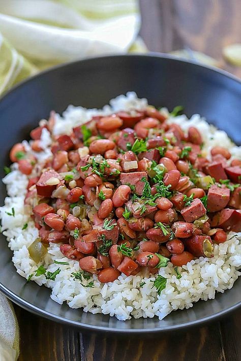 Make an incredible dinner tonight that everyone will love! These Cajun Red Beans & Rice Recipe is incredibly easy to throw together and tastes like it took a long time to make. So much flavor slow. cooked into one dish! Cajun Red Beans And Rice Recipe, Red Beans And Rice Recipe Easy, Recipes With Diced Tomatoes, Red Bean And Rice Recipe, Red Rice Recipe, Andouille Sausage Recipes, Healthy Rice Recipes, Chicken Broth Recipes, Red Beans N Rice Recipe