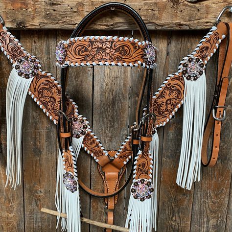 Browband, one ear, wither strap and breastcollar is floral tooled whipstitch style. They are decorated with copper AB crystal conchos/buckles and white fringe. Full Horse size Measurements Headstall measurements : bit to bit - 36" shortest setting : 44" longest settingBrowband measures 15" acrossBreastcollar measurements - From Center Ring to D Ring -16"Breastcollar including toggles : shortest settings - 26" : Longest settings -29" Lifetime guarantee on all crystals.Buy Together or Separate BRO Western Horse Tack Turquoise, Western Tack Sets, Barrel Racing Tack Rodeo, Bling Horse Tack, Horse Tack Accessories, Bling Tack, Wither Strap, Custom Leather Belts, Barrel Racing Tack