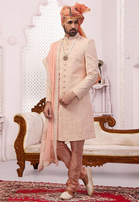 Faux Georgette Sherwani in Peach This Readymade Attire is Highlighted with Buttons, Resham, Zari and Sequins Work. Crafted in Chinese Collar and Full Sleeves Available with an Art Dupion Silk Churidar in Peach Do note: Dupatta, Turban, Kanthimala and Footwear shown in the image is for presentation purposes only. Half to one inch may vary in measurement. (Slight variation in actual color vs. image is possible) Pink Sherwani, Men Sherwani, Mens Sherwani, Light Peach Color, Sherwani For Men, Chinese Collar, Designer Suits For Men, Utsav Fashion, How To Look Handsome