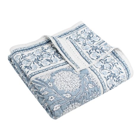 The Adare Blue Reversible Throw by Levtex Home is inspired by distinctive fashionable wall coverings. Offered in blue, navy and white, this design will immediately transform any room in your home. This throw features beautiful flowers in bloom and vines with a distinctive border all around on the front, reversing to a striped border floral vine design in blue on a white ground on the back. The Throw (50x60in.) has a cotton front and back, filled with a cotton-rich filler, and is machine washable. Enjoy this for years to come! Blue Floral Bedspread, Flowers In Bloom, Quilted Throw, Quilted Throw Blanket, Cozy Chair, Blue Throws, Vine Design, Quilt Stitching, White Quilt