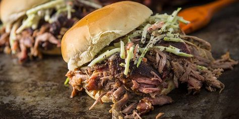 Pulled pork is brined in apple juice, slow smoked and loaded onto buns topped with BBQ sauce and homemade slaw. Pulled Pork Brine Recipe, Traeger Pulled Pork Recipe, Traeger Pulled Pork, Recipe For Pulled Pork, Paleo Bbq Sauce, Bbq Pulled Pork Recipe, Homemade Slaw, Bbq Pork Recipes, Grilled Roast