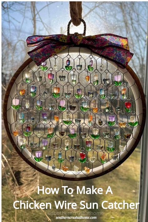 Handmade chicken wire suncatcher with colorful beads hanging in front of a window, demonstrating a craft project. Wire Sun Catcher, Wire Sun, Chicken Wire Art, Chicken Wire Crafts, Crystal Suncatchers Diy, Chicken Wire Frame, Suncatcher Diy, Diy Suncatchers, Easter Centerpiece