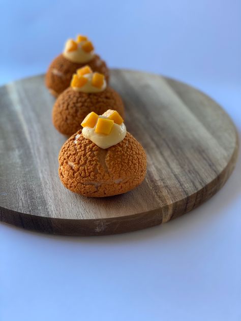 3 mango choux au craquelin topped with mango pieces on a wooden board with a white background. Mango Cream Puffs, Soft Desserts, Choux Cream, Creme Puff, Mango Cream, Baking Desserts, Cream Puff, Food Business, Cream Puffs