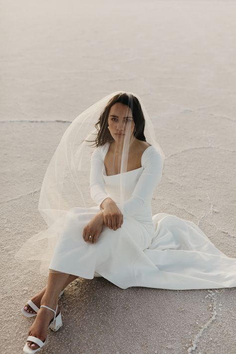 Alixann Loosle Photography, Bonneville Salt Flats, Utah Salt Flats, Salt Flats wedding, salt flats elopement, salt flats bridal, bride and groom portraits, couples pose ideas, bride pose ideas, long sleeve wedding dress, slinky wedding dress, fitted wedding dress, classic wedding dress, sleek wedding dress, unique couples pose, bridal session, utah wedding photography, bridals Salt Flats Bridals, Salt Flats Elopement, Wedding Dress Sleek, Slinky Wedding Dress, Salt Flats Wedding, Private Elopement, Utah Salt Flats, Wedding Dress Fitted, Sleek Wedding Dress