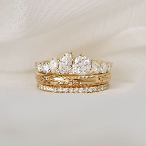 Dream stack ALERT! 😊 Looking for the perfect stacking ring set for your bridal set, upgrade, or just to get yourself a little bling? Your quest ends here. Build your dream stack with us on our website today! 💕 Comment below if this is your dream stack! Marquise & Round Firework Diamond Mosaic Band (Product ID: B0347) Women’s Olive Branch Wedding Ring (Product ID: B0640) Delicate French Pavé Eternity Diamond Wedding Ring (Product ID: B0178) #uniqueengagementring #vintageinspiredengagement... Branch Wedding Ring, Wide Engagement Ring, Olive Branch Wedding, Ring Upgrade, Mens Diamond Band, Wedding Ring Styles, Wedding Day Jewelry, Stacking Ring Set, Gem Nails