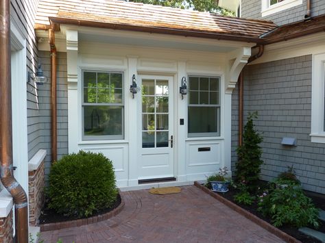 This breezeway connects the 3-car garage to the house, while providing a place to store coats and shoes on the way in. Enclosed Breezeway Ideas, Enclosed Breezeway, Breezeway Ideas, Garage Door Types, Garage Door Styles, Converted Garage, Architectural Design Studio, Garage Addition, Ranch Remodel