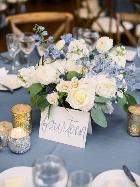 Flower Centerpiece with blue delphinium and silver mercury glass votives Elegant Blue Centerpieces, Dusty Blue Floral Centerpieces, Dusty Blue White And Silver Wedding, Dusty Blue Wedding Flowers Centerpieces, Dusty Blue And Navy Centerpieces, Dusty Blue And White Centerpieces, Something Blue Centerpiece, Light Blue And White Centerpieces, Light Blue Silver And White Party Decorations