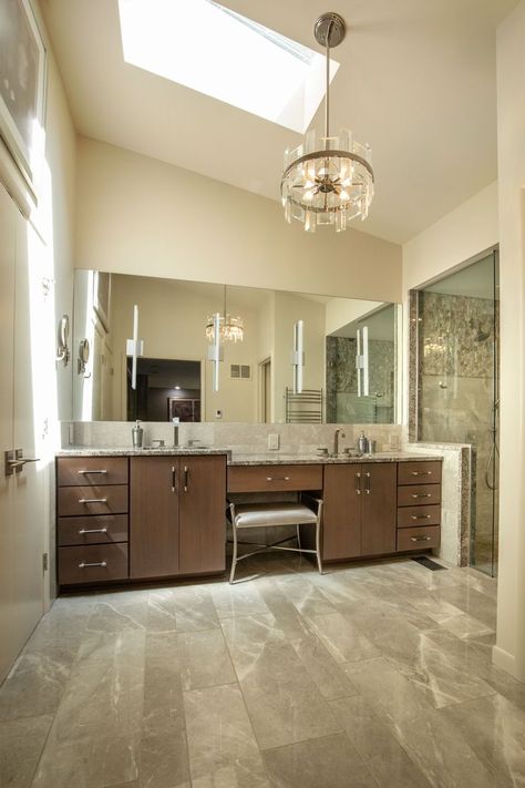 These homeowners wanted a bathroom to better utilize the room and incorporate updated products and innovation. With a new layout that better utilized the space we incorporated natural elements His and her vanities were designed in two heights to accommodate the difference in homeowner heights and an end cap separating the vanity from the shower was installed. Check out the before to after in our link. His And Her Vanities Master Bath, Modern 70s Home, His And Hers Bathroom, Full Mirror, 70s Home, Makeup Desk, Creative Bathroom, Spa Like Bathroom, Radiant Floor Heating