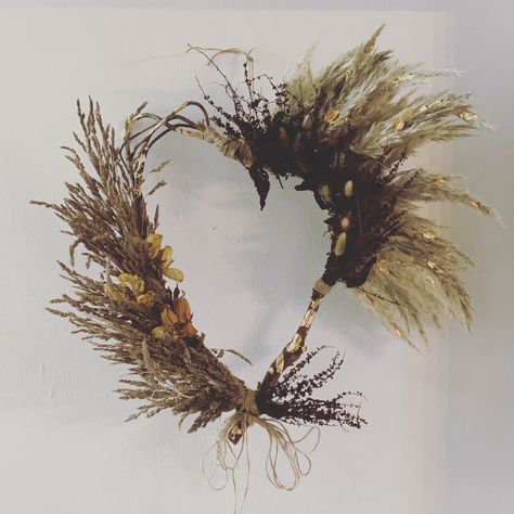 Gold leaf infused heart wreath #wreathsforfrontdoor #wreath #weddingdecor #fall #falldecor #pampasgrasswedding #pampasgrassdecor #driedflowerwreath Wall Decoration Wedding, Pampas Grass Wreath, Wedding Venue Decor, Grass Wreath, Heart Shaped Wreaths, Dried Pampas, Pampas Grass Decor, Dried Flower Wreaths, Grass Wedding