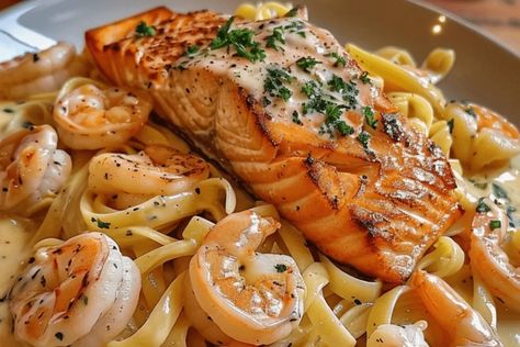 Indulge in this creamy Salmon and Shrimp Alfredo recipe. Rich seafood, tender pasta, and a luscious Alfredo sauce. Perfect for any dinner! Salmon And Shrimp Alfredo Pasta, Salmon Alfredo Pasta Recipes, Seafood Alfredo Pasta, Salmon And Shrimp Recipes, Salmon And Shrimp Alfredo, Salmon Alfredo Pasta, Pasta Salmon, Seafood Alfredo, Shrimp Stuffed Mushrooms