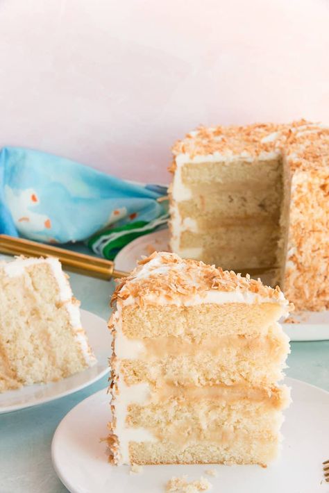 This Toasted Coconut Cake has layers upon layers of coconut flavor. A tender, moist coconut cake sandwiches creamy toasted coconut pastry cream and is wrapped in a coconut buttercream before being garnished with more toasted coconut flakes. Perfect for springtime celebrations. #cake #coconutcake #layeredcakes #cakerecipe #dessertrecipe #sweets #Easterdessert #springdessertrecipe #baking #cakedecorating #coconutcustard #coconutpudding #buttercreamfrosting #coconutfrosting #springbaking Toasted Coconut Cake Recipe, Coconut Pastry Cream, Toasted Coconut Cake, Moist Coconut Cake, Coconut Pastry, Cake Cream Filling, Best Coconut Cake Recipe, Coconut Layer Cake, Cake Sandwiches