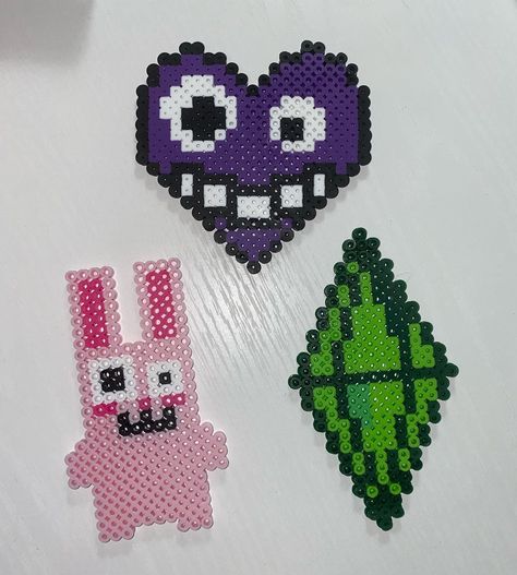 Sammy on Instagram: “In honor of the Sims 4’s 6th anniversary, I thought it would he appropriate to post my Sims creations! Freezer bunny, the Plumbob, and the…” Plumbob Diy, Perler Bobs Burgers, Bobs Burgers Perler Beads, Bobs Burger Perler Bead Patterns, Perler Beads Simpsons, Perler Bead Patterns Memes, Melts Beads, Melted Beads, My Sims