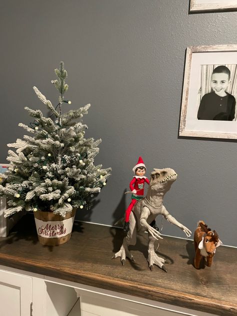 Elf on the shelf rides dinosaur Elf On Shelf Dinosaur, Elf On Shelf, On The Shelf, Elf On The Shelf, Dinosaurs, Elf, Shelves, Holiday Decor, Home Decor