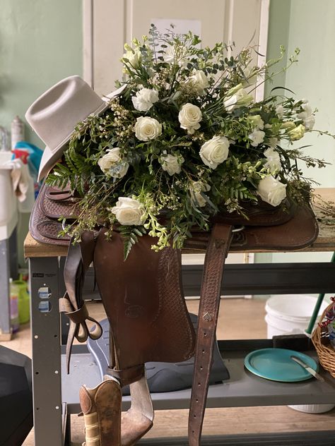 This unique piece was created for a cowboy local. Customer brought in saddle and cowboy hat to attach casket spray to. A special moment from last summer. White Casket, Sympathy Floral, Casket Spray, Casket Flowers, Long Stem Roses, Grave Flowers, Casket Sprays, Roses Garden, Memorial Flowers