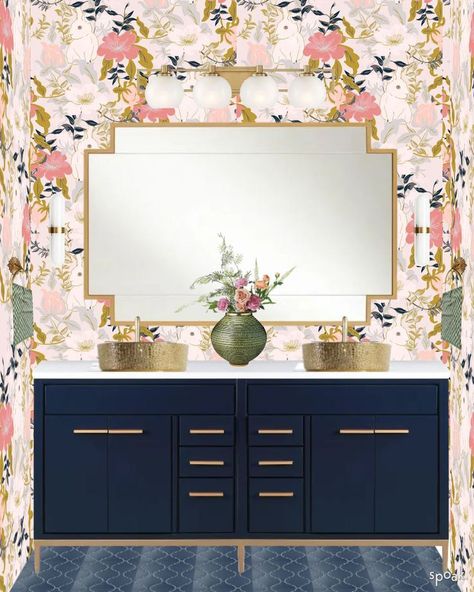 Bathroom with pink floral wallpaper, navy blue vanity with gold accents, gold vessel sinks, and a gold geometric mirror. Pink Blue Gold Bathroom, Navy Blue Pink And Gold Bathroom, Pink Navy Bathroom, Navy Pink Bathroom, Bold Floral Wallpaper Bathroom, Navy And Pink Bathroom Ideas, Navy Blue And Pink Bathroom, Navy And Blush Bathroom, Navy And Pink Bathroom