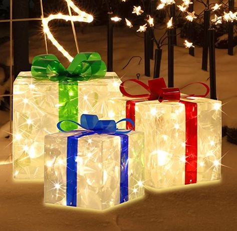 Three boxes are connected together by the wire and distance between each is 27.5'' and the leading wire is 118‘’ in length.
🎁PREMIUM QUALITY: lighted Christmas gift boxes is designed with a sturdy metal frame covered with premium transparent PVC with IP44 waterproof power adapter. It is great ideal to light up your Christmas season. ETL certicated and 6pcs metal Stakes included. Box Christmas Decorations, Up Decorations, Christmas Gift Boxes, Cartoon Giraffe, Giraffe Pattern, Floral Print Pants, Christmas Gift Box, Summer Gift, Christmas Box