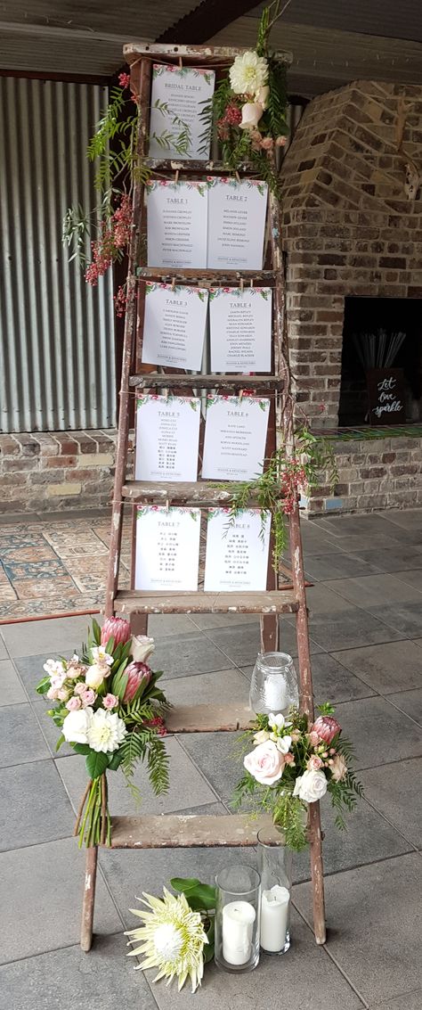 Rustic Ladder seating chart at Mali Brae Farm Ladder Wedding Seating Chart, Seating Chart Ladder, Blanket Ladder Seating Chart Wedding, Ladder Seating Chart, Farm Wedding Seating Chart, Rustic Wedding Seating Chart Ideas, Ladder Wedding Decor, Wedding Ladder, Rustic Wedding Seating Chart