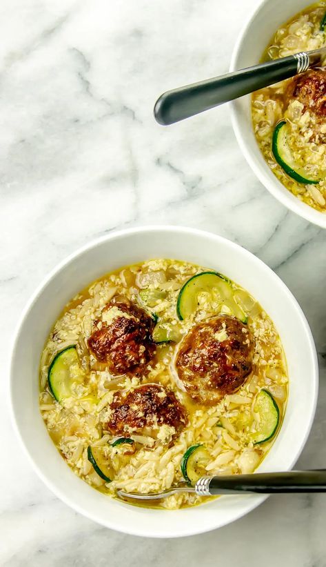 Make a quick and healthy meal with this Zucchini Meatball Soup, ready in just 20 minutes! The air fryer makes cooking the meatballs a breeze, while the zucchini and orzo are simmered in a savory broth made with garlic, onion, and Italian seasoning. This soup is perfect for those nights when you want something nutritious and delicious without spending too much time in the kitchen. Save this pin for when you need a quick recipe! Blooming Onion Petals, Meatball Orzo Soup, Meatballs Zucchini, Meatball Orzo, Air Fryer Blooming Onion, Air Fryer Recipes Salmon, Onion Petals, Crispy Potato Wedges, Easy Meatball