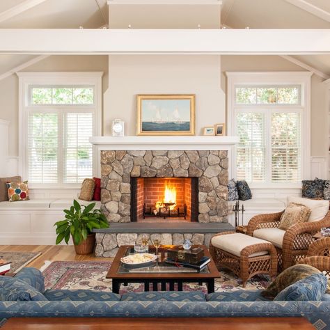 Fireplace season is almost here.🔥 We couldn’t resist sharing this fieldstone fireplace our team designed and built for a condo renovation in Dennis. Flanked by built-in window seats, the traditional wood-burning fireplace anchors the great room visually. The raised hearth, with a bluestone cap, is seven feet wide and 18 inches tall, creating a space to sit while tending to the fire. 🍂🍁Are you looking forward to fireplace season? Design/Build: McPhee Associates 📸: @dancutronaphoto See the... Fireplace And Window Seats, Bluestone Fireplace, Raised Hearth Fireplace, Fieldstone Fireplace, Raised Hearth, Hearth Fireplace, Built In Window Seat, Condo Renovation, Fireplace Built Ins