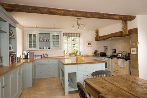 Who else loves this Cotswold Farmhouse Kitchen, with stunning duck egg blue in-frame shaker style design? It's even got an Aga and wooden beam ceiling. #cotswolds #kitcheninspo #farmhousekitchen #shakerkitchen #estateagent #warwickshire Wooden Beam Ceiling, Farm Kitchen Ideas, Beam Ceiling, Wooden Beam, Country Cottage Kitchen, Open Plan Kitchen Dining, Rustic Kitchen Design, Cottage Kitchens, Farm Kitchen