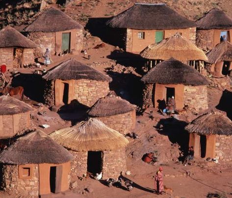 Circular huts are the traditional houses of the Sotho people of Lesotho.  (Nicholas DeVore—Stone/Getty Images) African Houses, African Hut, Primitive Houses, African Architecture, African House, Suid Afrika, Travel Africa, Traditional Culture, Life Styles