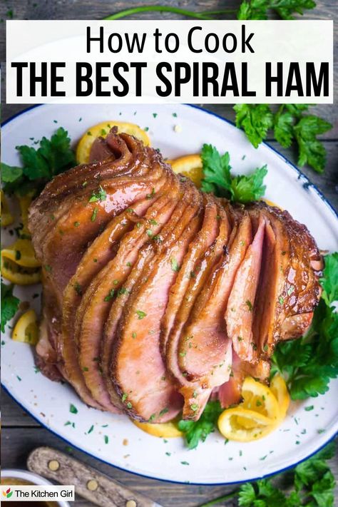 A plate of sliced spiral ham garnished with orange slices and parsley, accompanied by the text How to Cook the Best Spiral Ham. Sauce For Spiral Ham, Best Way To Cook Spiral Ham, Cooking Spiral Ham In Electric Roaster, Glaze For Fully Cooked Spiral Ham, How To Bake Spiral Ham In Oven, How To Cook A Spiral Ham Crock Pot, Spiral Cut Ham In Oven, Cook A Ham In The Oven, Baked Spiral Ham Recipes Oven