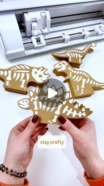 Dinosaur Mama | Craft Tutorials | Free SVG Files on Instagram: "How cute are these little Dino bone treat boxes. You can even use them for Dino party decor 🦖🦕  I used my @silhouette.inc Cameo 5 (and Portrait 3) to cut these guys out and found the designs on the Silhouette Design store.   Tip: if your paper crafts have a lot of pieces to place - save the middle as a guide. This also works great for lettering!   #craftthings #silhouettecameo #silhouettestudio #silhouettecameo5 #papercraft" Dinosaur Party Diy, Cricut Dinosaur Projects, Paleontology Party, Diy Dinosaur Decor, Dino Party Decor, Dinosaur Classroom, Dino Bones, Dinosaur Projects, Kids Projects