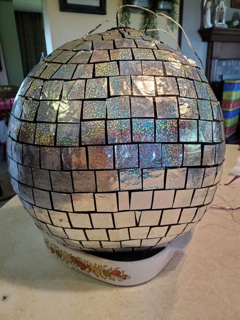 This is NOT the quick way of making a disco ball but it worked for me. Disco Pinata, Disco Ball Pinata, Bola Disco, Paper Mache Pinata, Diy Disco Ball, Disco Theme Party, Rock Fest, Juke Box, New Years Eve Food