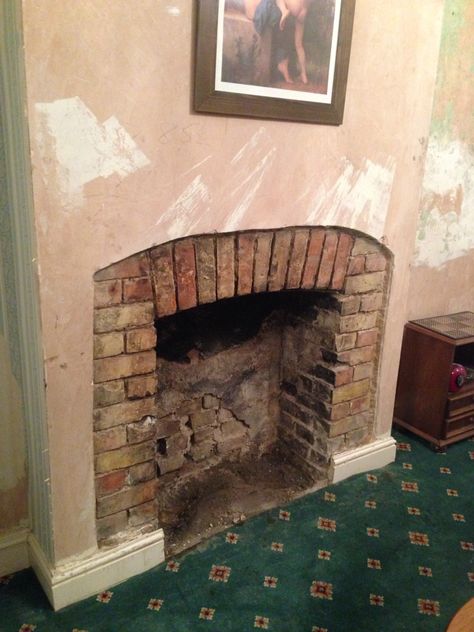 A hammer. A saw. An angle grinder. (And some crossed fingers)... Revealed this Victorian brick fireplace hidden by plaster board and ugly wall paper. Fireplace #1 just needed cleaning, pointing, hearth building, tiling and groating. Paper Fireplace, Victorian Fireplaces, Modern English Cottage, Plaster Board, Victorian Fireplace, Environment Reference, House Wallpaper, Modern English, Building Material